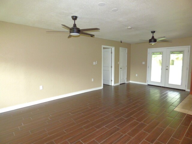 5335 Idylwood St, Beaumont, TX 77703 - spare room with a ceiling fan, baseboards, french doors, and dark wood finished floors