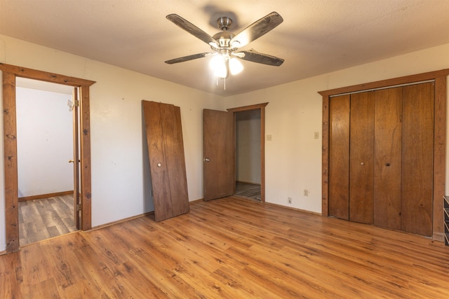 unfurnished bedroom with a closet, ceiling fan, and light hardwood / wood-style flooring