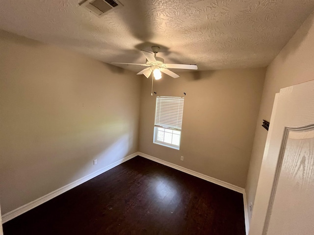 479 Reynolds Ln, Vidor, TX 77662 - empty room featuring visible vents, dark wood-style flooring, baseboards, a textured ceiling, and a ceiling fan