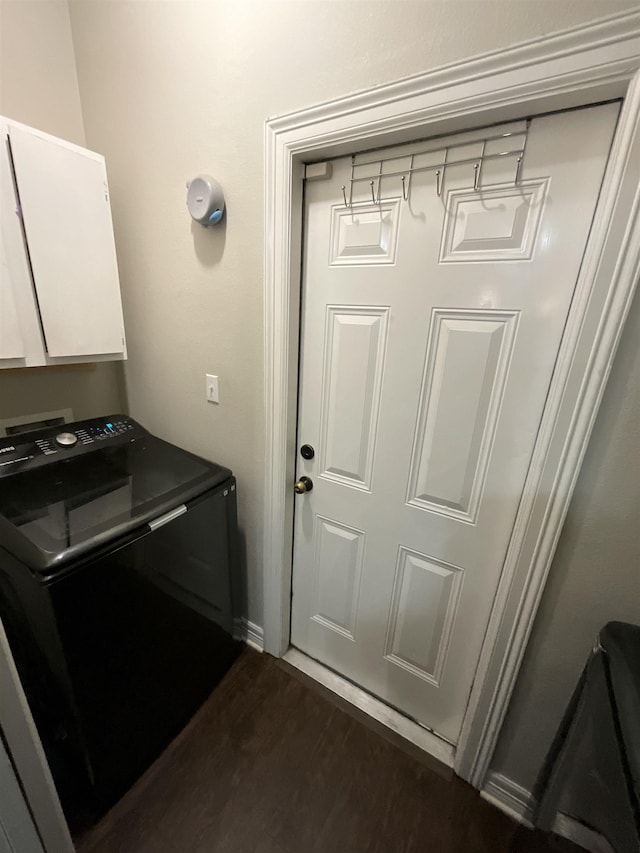 479 Reynolds Ln, Vidor, TX 77662 - laundry room featuring cabinet space, washer / dryer, and dark wood-type flooring