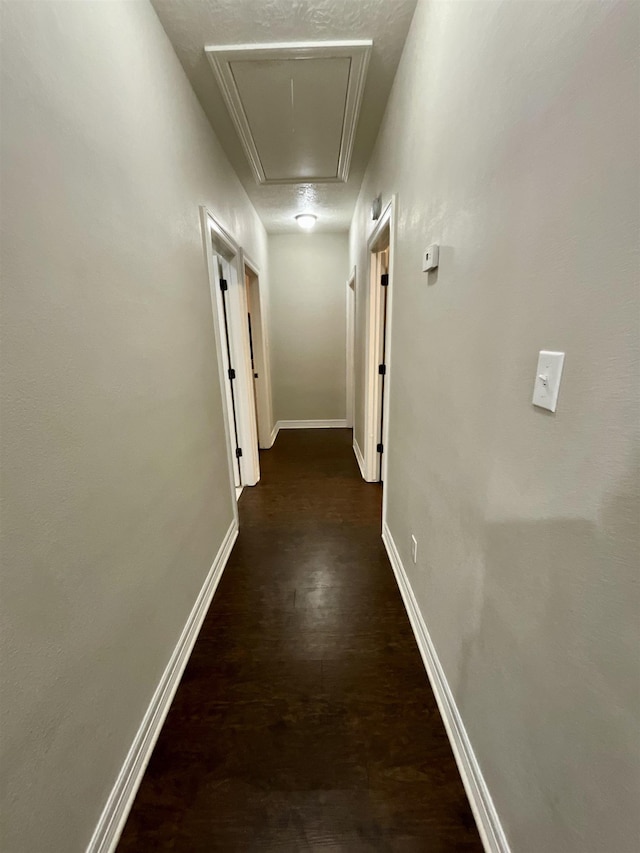 479 Reynolds Ln, Vidor, TX 77662 - hallway with dark wood-style flooring, baseboards, and attic access