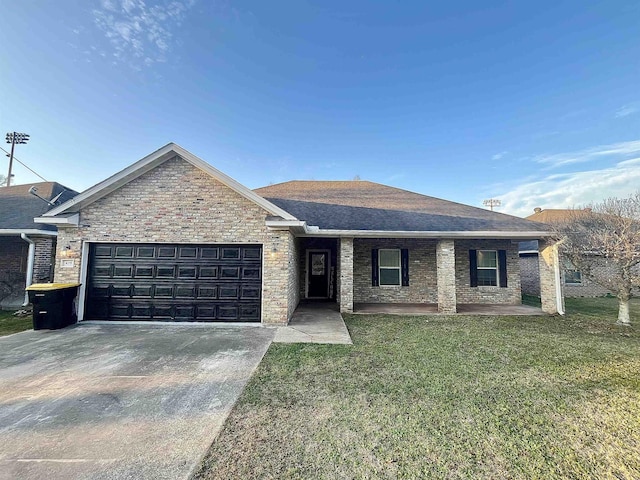 single story home featuring a garage, concrete driveway, a shingled roof, and a front yard