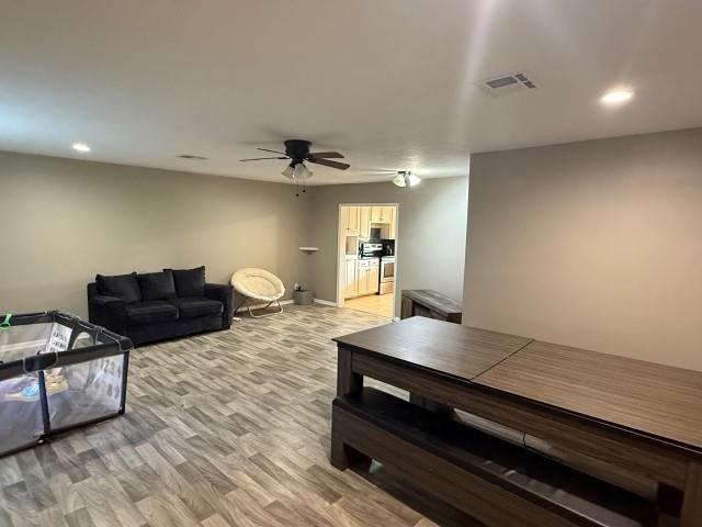 1445 Bahama Dr, Vidor, TX 77662 - living area with ceiling fan, light wood-style flooring, and recessed lighting