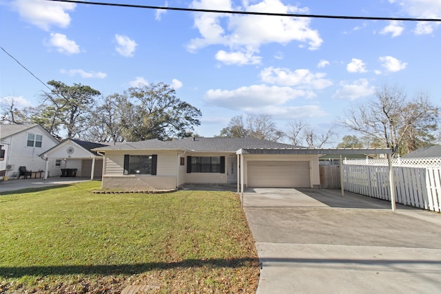 ranch-style home featuring a front lawn and a garage