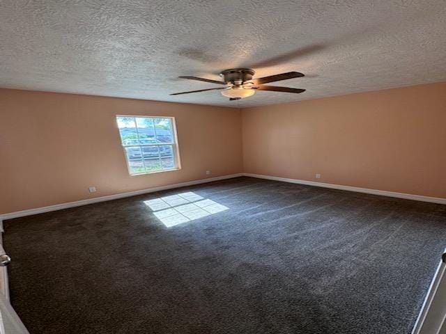 unfurnished room featuring dark colored carpet, a textured ceiling, and ceiling fan