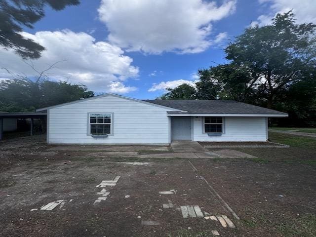 exterior space with a carport