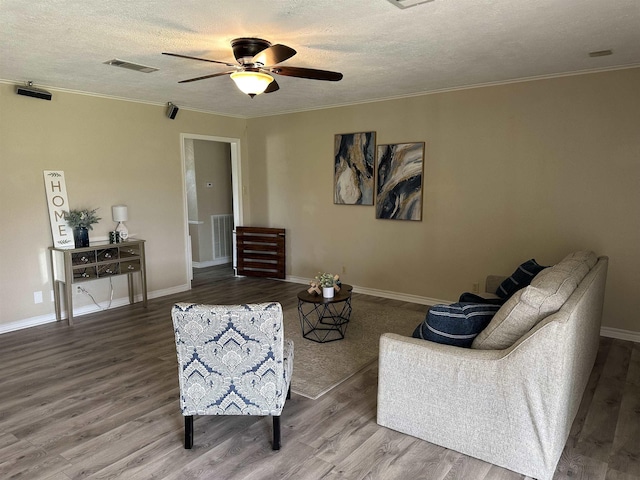 637 Ridgewood Dr, Port Neches, TX 77651 - living room with wood finished floors, crown molding, a textured ceiling, and ceiling fan