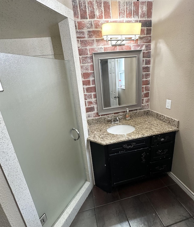 bathroom with vanity and tile patterned flooring