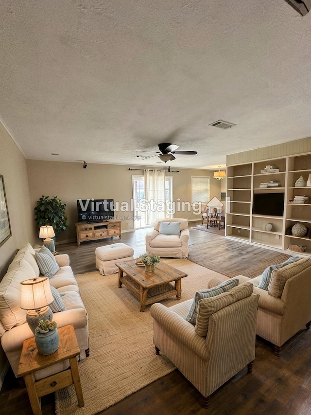 637 Ridgewood Dr, Port Neches, TX 77651 - living area featuring a textured ceiling, wood finished floors, and ceiling fan