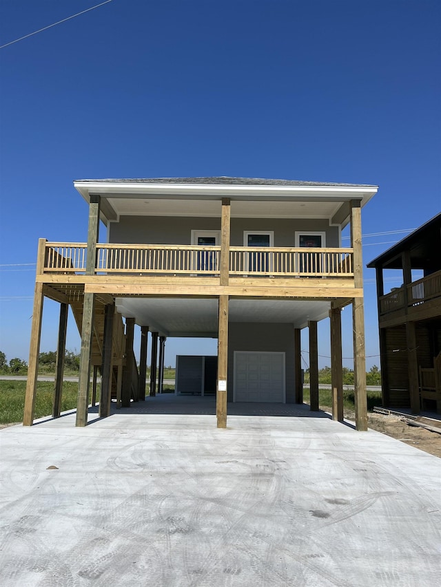 beach home featuring a garage and a carport