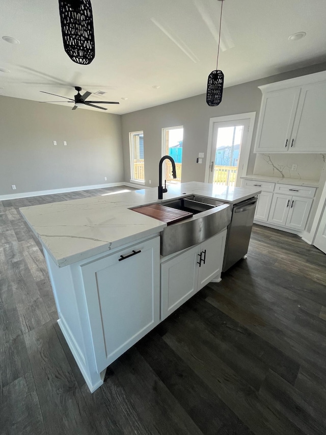 kitchen with pendant lighting, white cabinetry, a healthy amount of sunlight, and sink