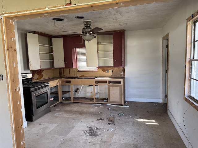 kitchen featuring ceiling fan and stainless steel gas range