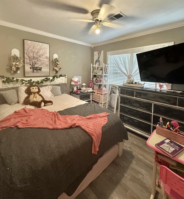 bedroom with hardwood / wood-style flooring, ceiling fan, and ornamental molding