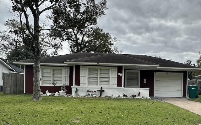 ranch-style home featuring a garage and a front lawn