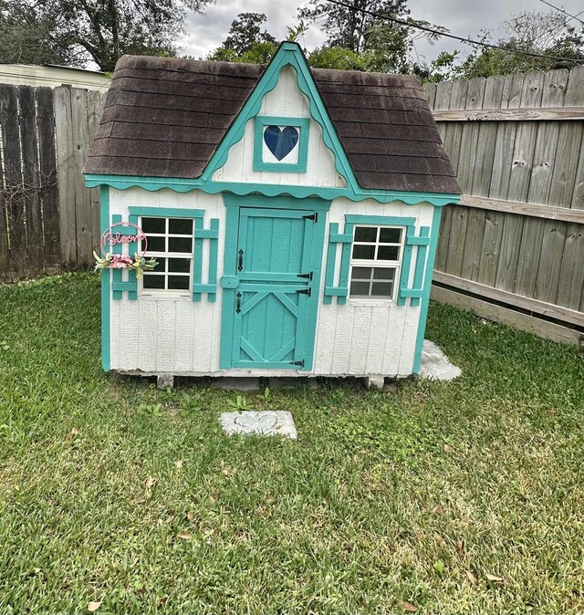 view of outbuilding with a yard