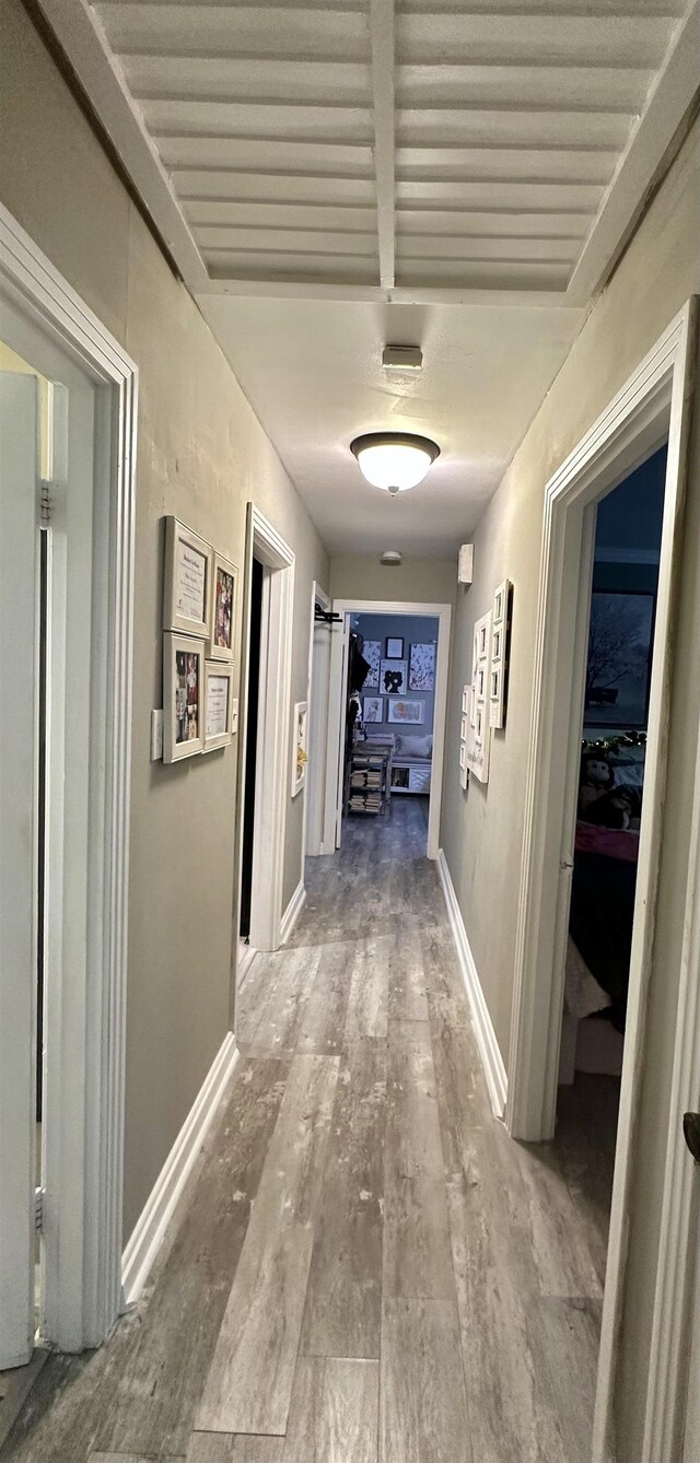 hallway featuring hardwood / wood-style flooring