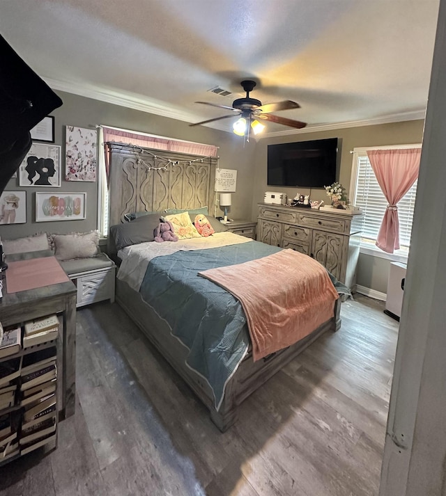 bedroom with ceiling fan, hardwood / wood-style floors, and crown molding