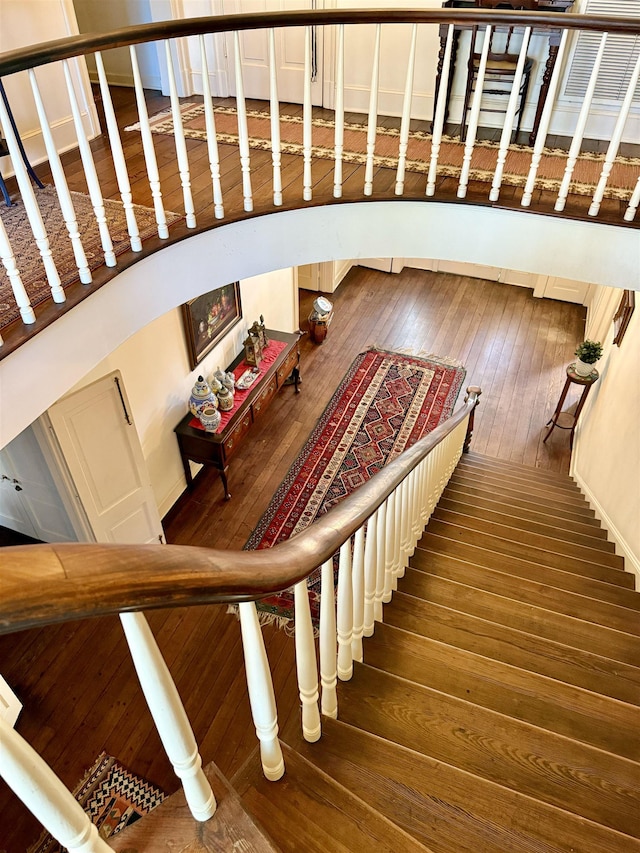 stairs with hardwood / wood-style floors