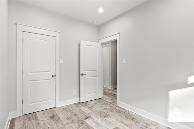 unfurnished bedroom featuring light hardwood / wood-style floors