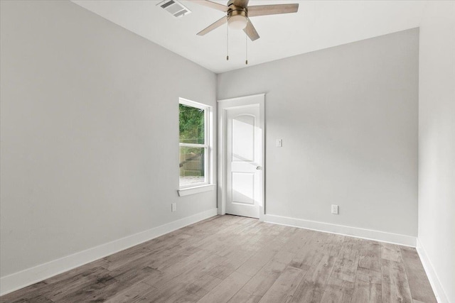 spare room featuring ceiling fan and light wood-type flooring