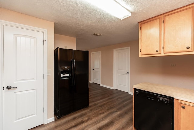 kitchen with baseboards, dark wood-type flooring, light countertops, a textured ceiling, and black appliances