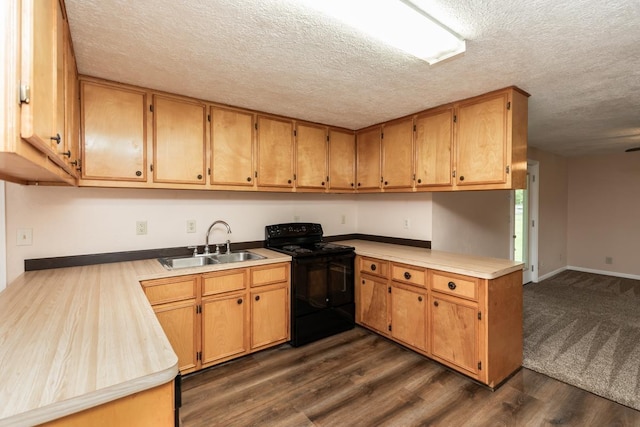kitchen with dark wood-style flooring, a peninsula, a textured ceiling, black electric range, and a sink