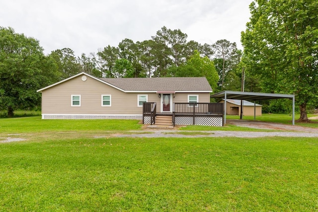 view of front facade featuring a deck, driveway, a front yard, and a detached carport