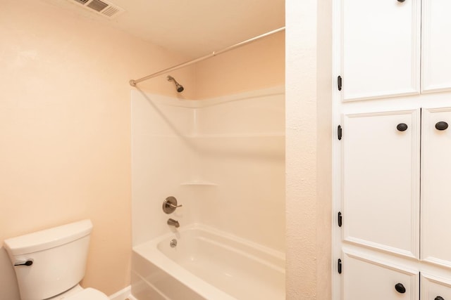 bathroom with toilet, shower / bath combination, and visible vents