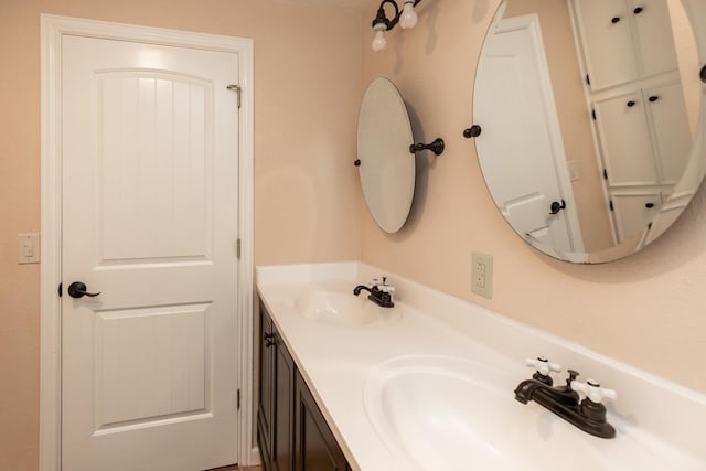 bathroom with double vanity and a sink