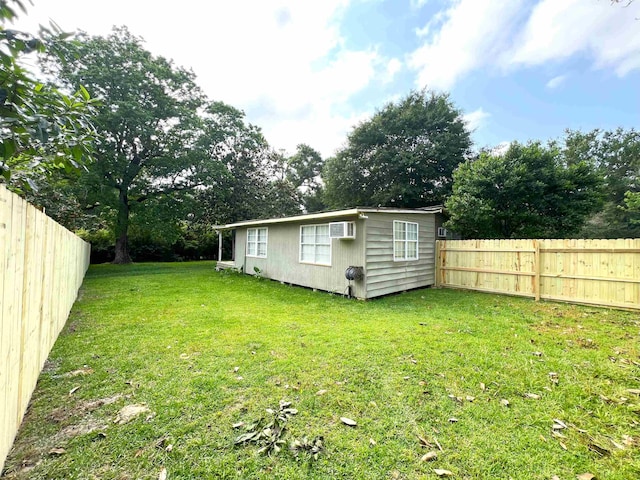 view of yard with a wall mounted AC