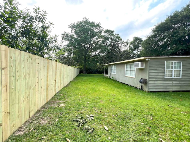 view of yard with a wall mounted AC