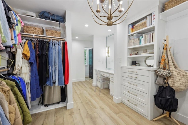 11109 County Road 701, Buna, TX 77612 - spacious closet featuring radiator heating unit, light wood-type flooring, and a chandelier