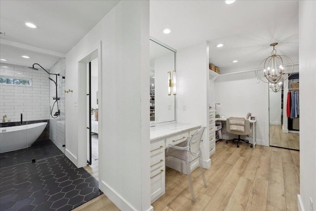 11109 County Road 701, Buna, TX 77612 - bathroom featuring recessed lighting, a freestanding tub, wood finished floors, baseboards, and connected bathroom