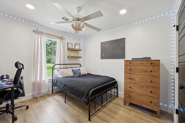 11109 County Road 701, Buna, TX 77612 - bedroom with light wood finished floors, a desk, recessed lighting, and a ceiling fan