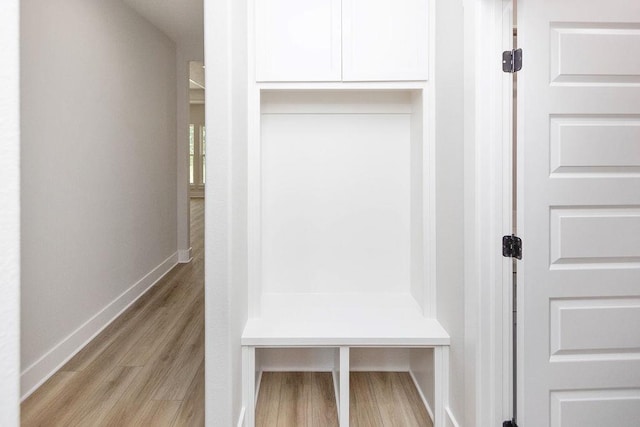 mudroom with light hardwood / wood-style floors