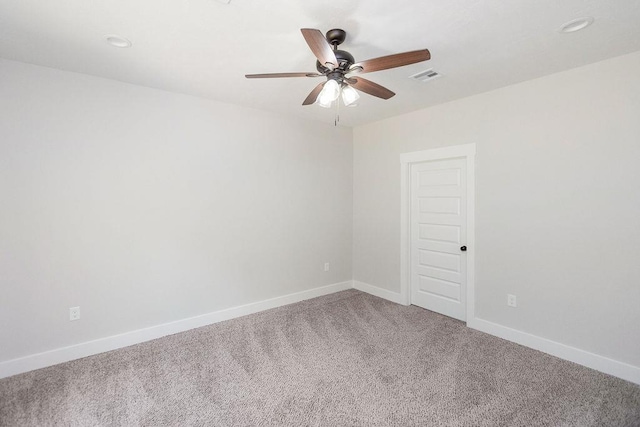 unfurnished room with ceiling fan and carpet floors