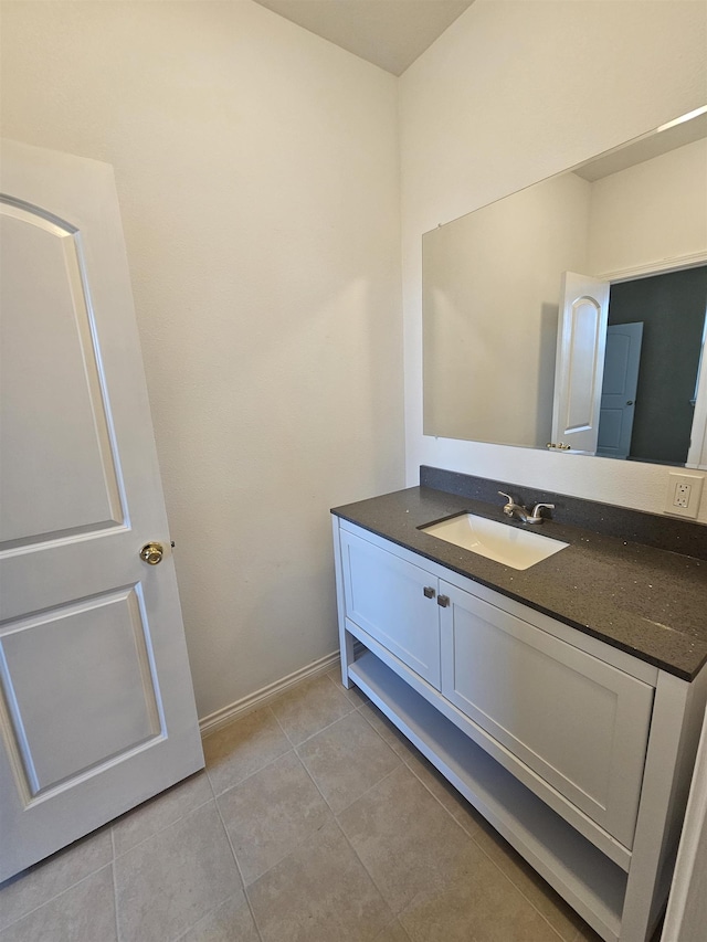 bathroom featuring tile patterned flooring and vanity