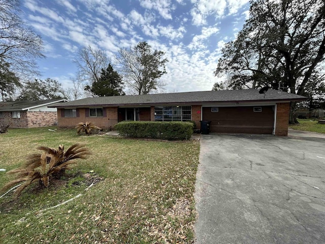 ranch-style home with a front lawn and a garage