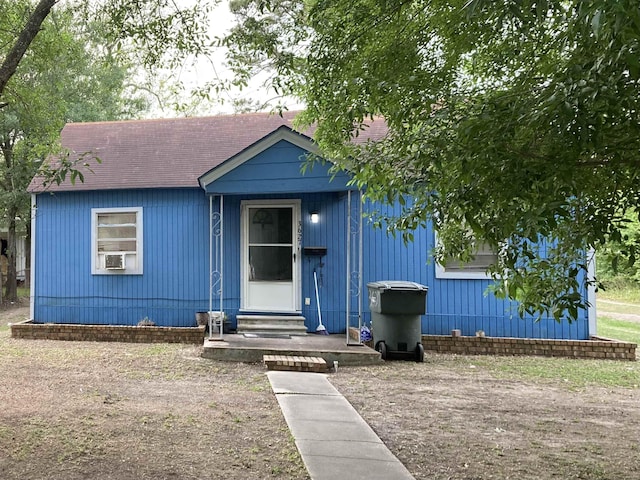 view of front of house featuring entry steps and a shingled roof