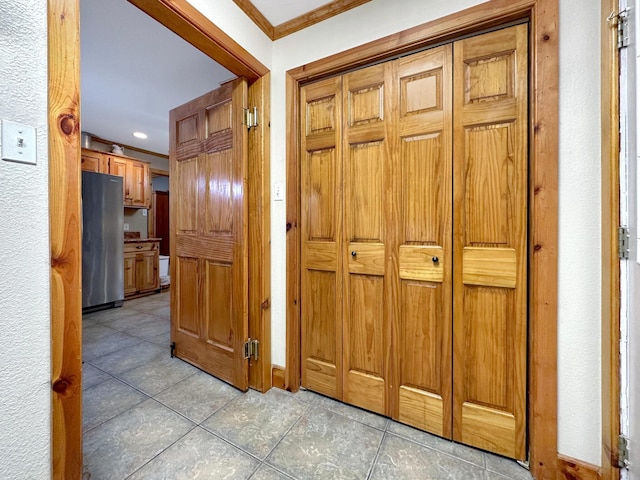 corridor featuring crown molding