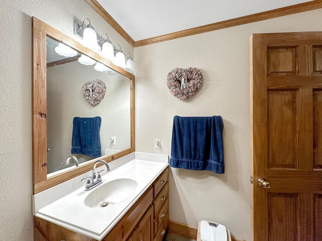 bathroom with vanity and ornamental molding