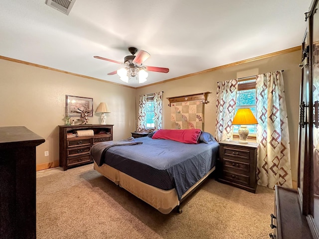 carpeted bedroom with ceiling fan, ornamental molding, and multiple windows