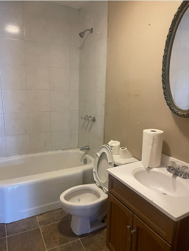 full bathroom with vanity, toilet, and tiled shower / bath