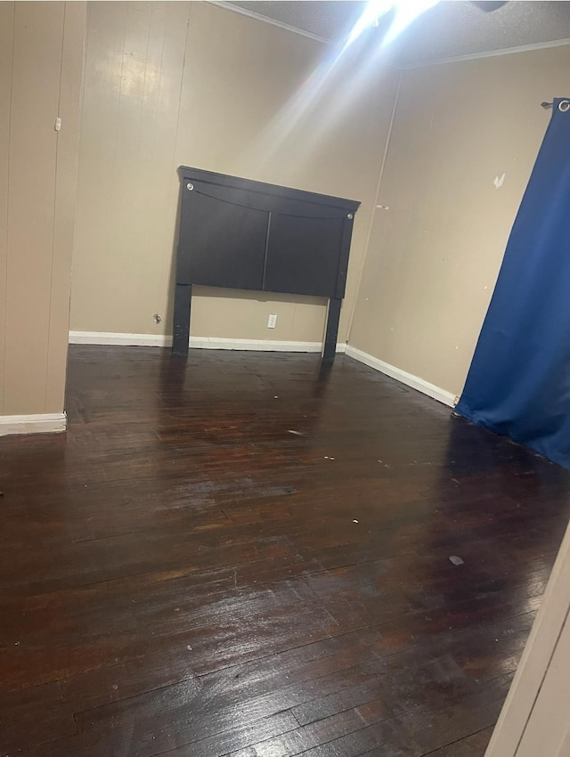 spare room with dark hardwood / wood-style floors