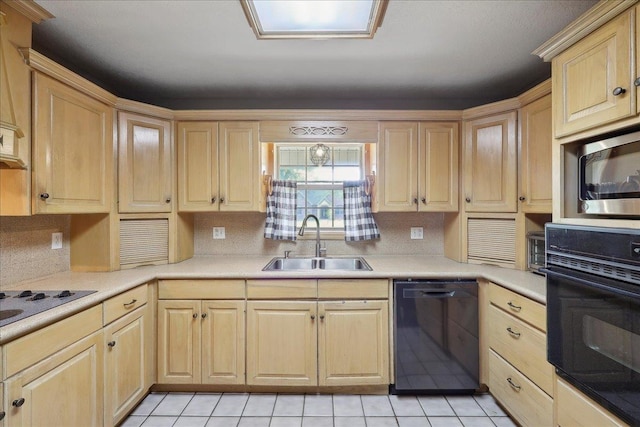 132 County Road 760, Buna, TX 77612 - kitchen with a sink, light tile patterned floors, black appliances, light brown cabinetry, and light countertops