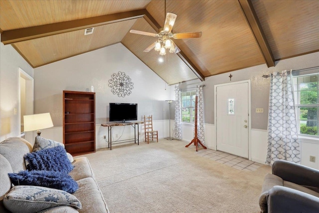 132 County Road 760, Buna, TX 77612 - carpeted living area featuring wood ceiling, visible vents, lofted ceiling with beams, and a wainscoted wall