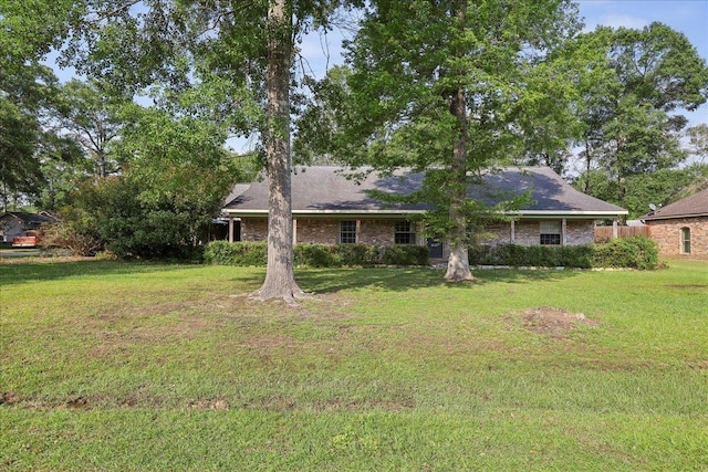 132 County Road 760, Buna, TX 77612 - rear view of house featuring a yard