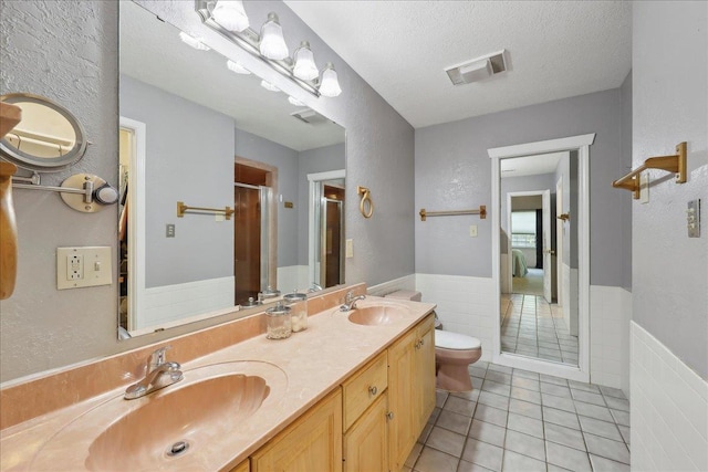 132 County Road 760, Buna, TX 77612 - full bath featuring a stall shower, visible vents, tile patterned flooring, and a sink