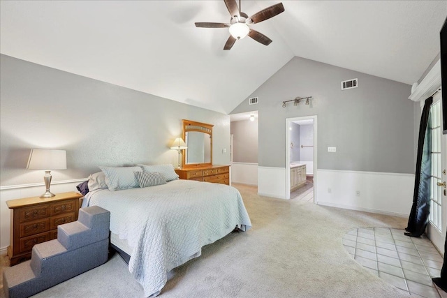 132 County Road 760, Buna, TX 77612 - bedroom featuring a wainscoted wall, visible vents, light carpet, and high vaulted ceiling