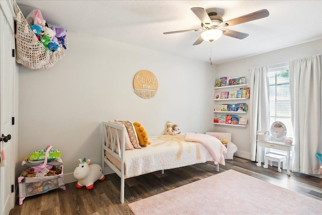 bedroom featuring wood-type flooring and ceiling fan